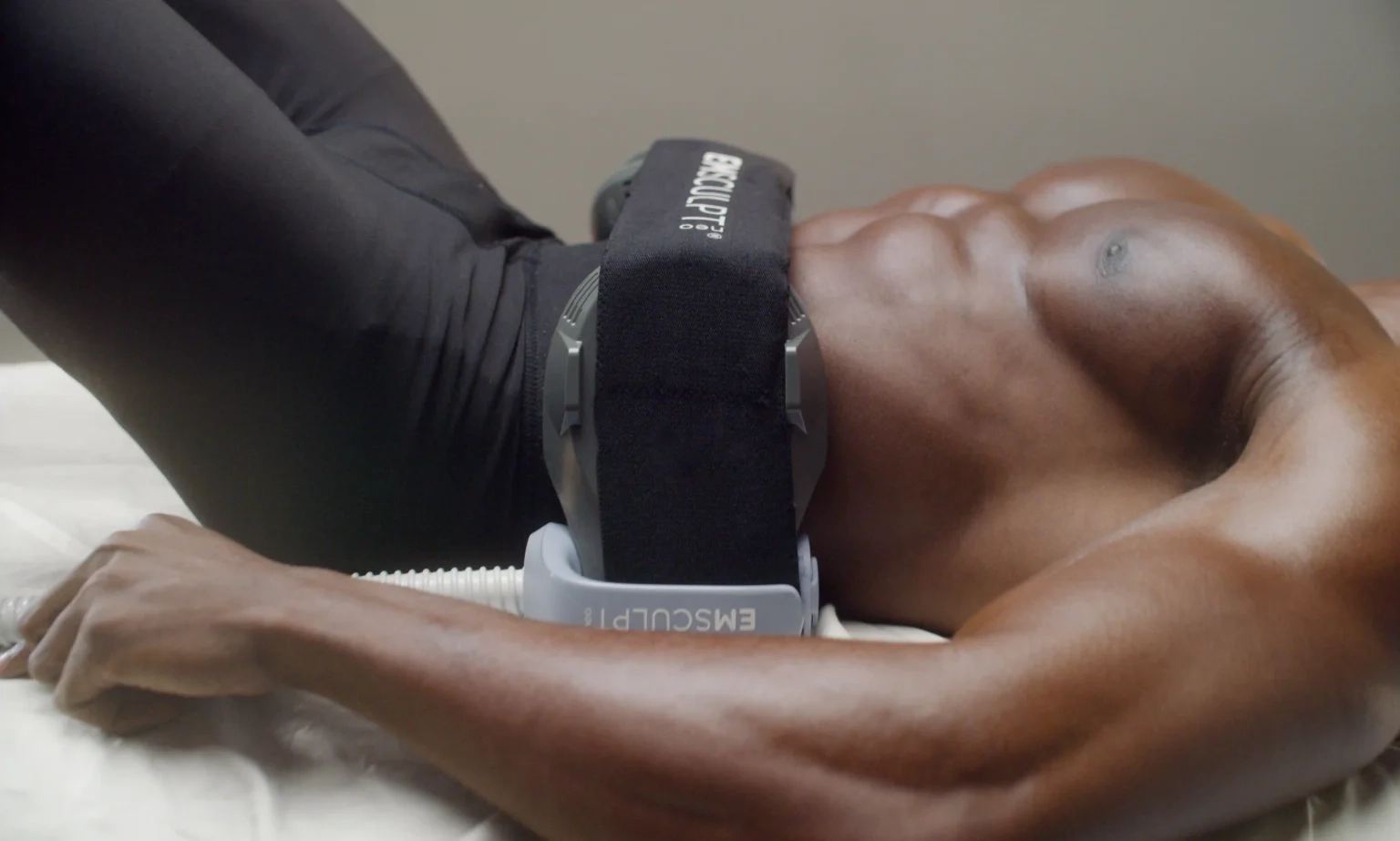 A toned abdomen during an Emsculpt Neo body treatment