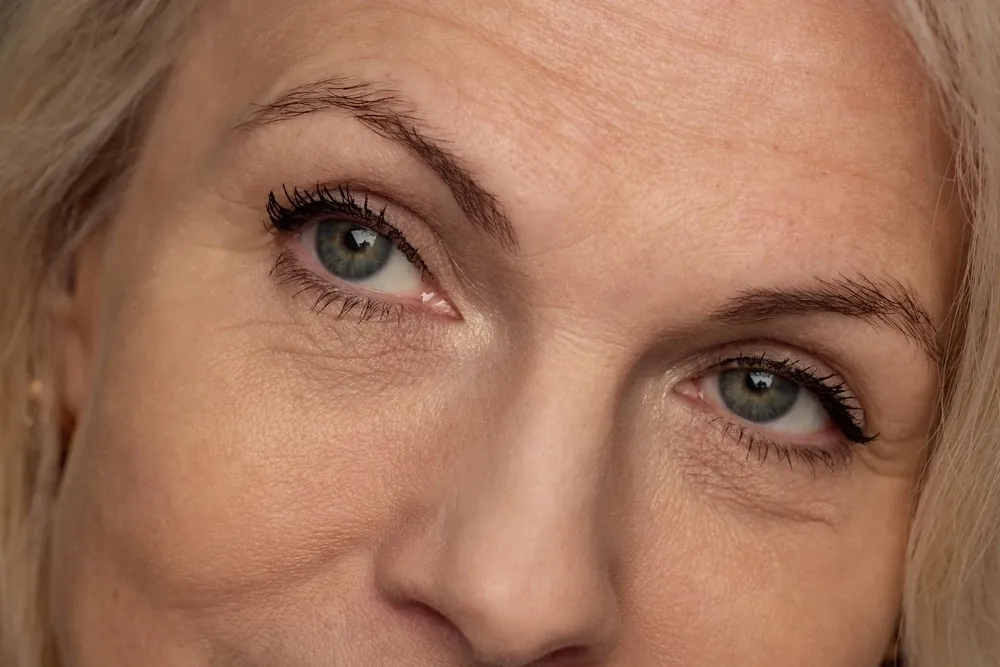 Close-up of a woman's eyes and the fine lines around them
